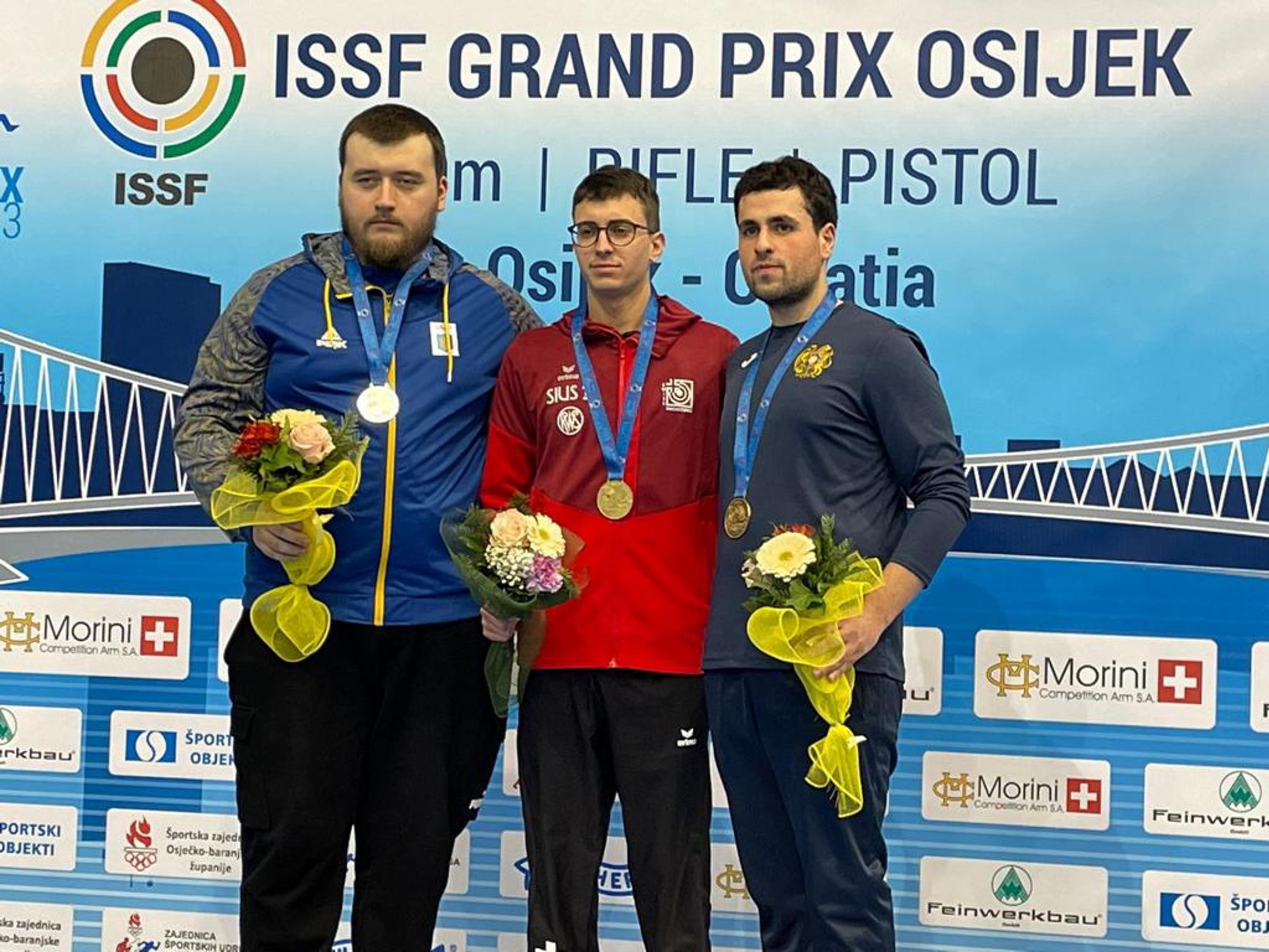 Das Podest Pistole 10m: 2. Pavlo Korostylov (UKR), 1. Jason Solari, 3. Bennik Khlghatyan (ARM).
